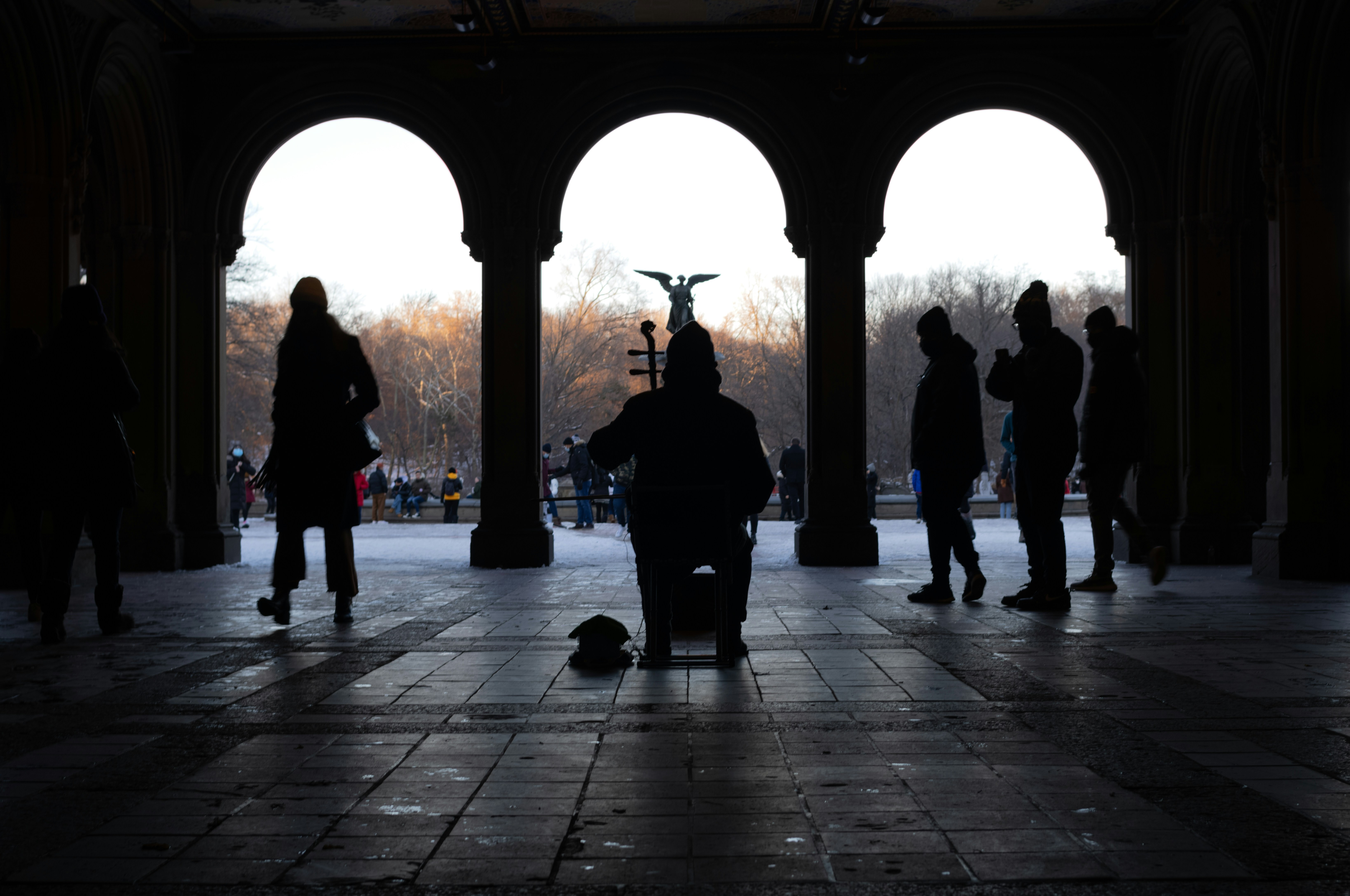a group of people standing around a building