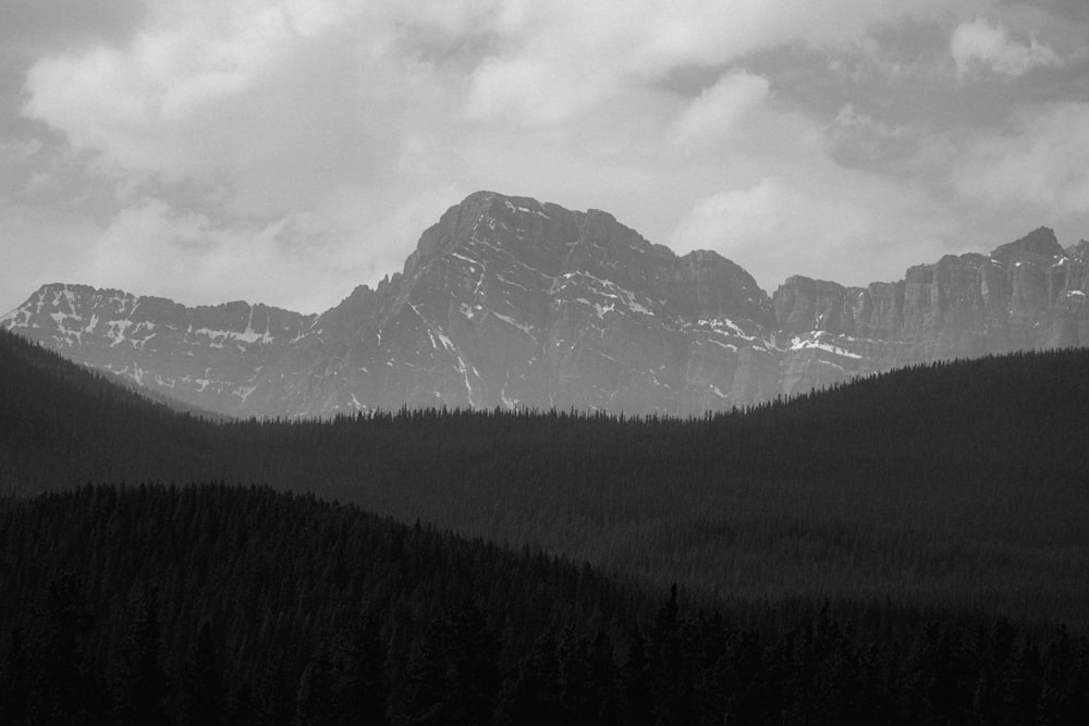 a black and white photo of a mountain range