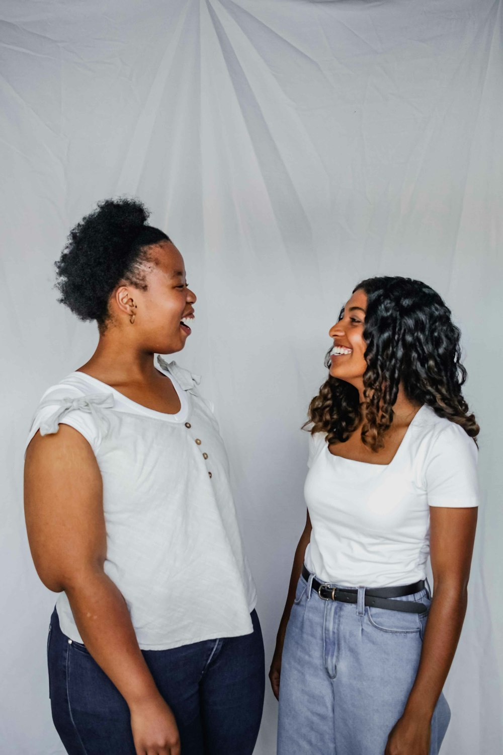 a couple of women standing next to each other