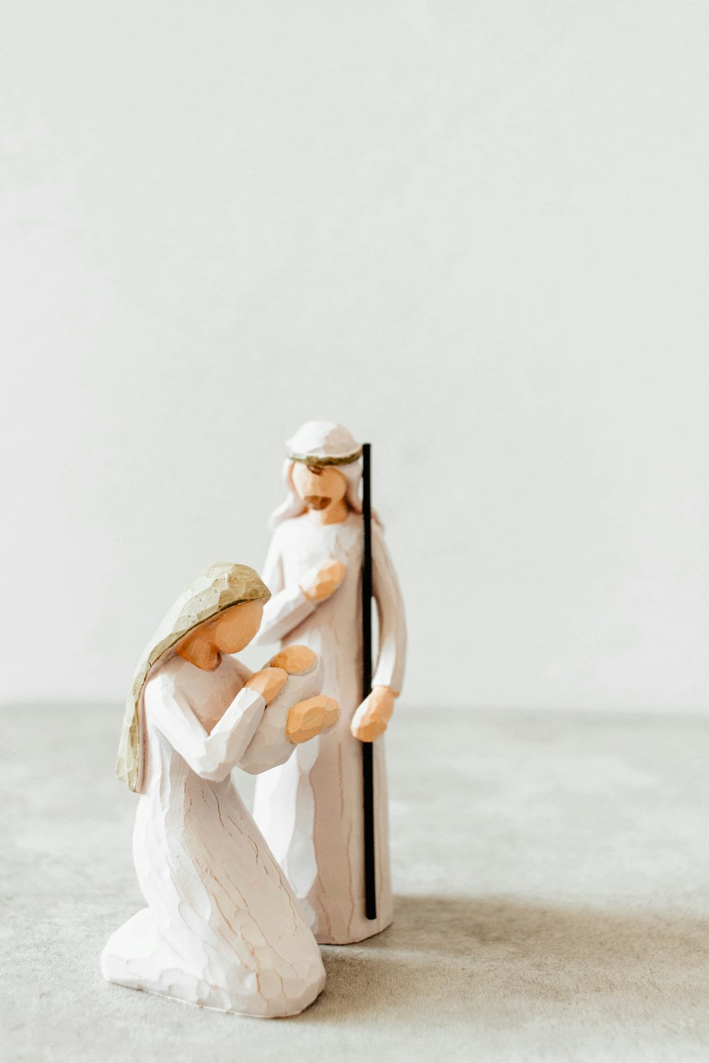 a figurine of a man holding a woman