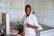 A smiling professional in a food safety training session.