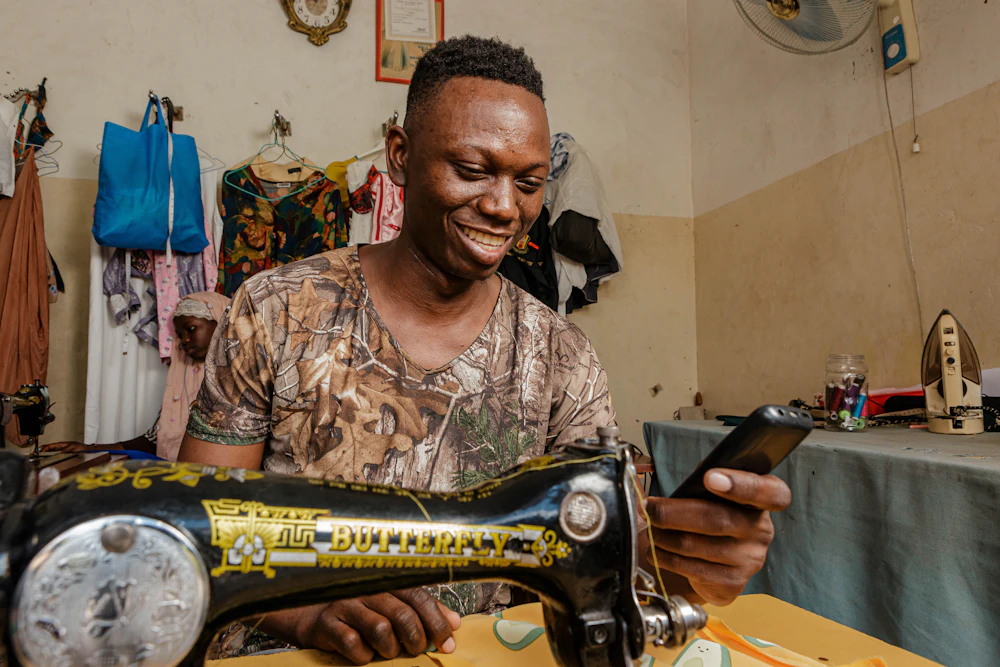 Malawian tailor and small business owner at work