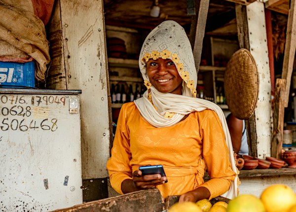 Market vendor completing a mobile payment