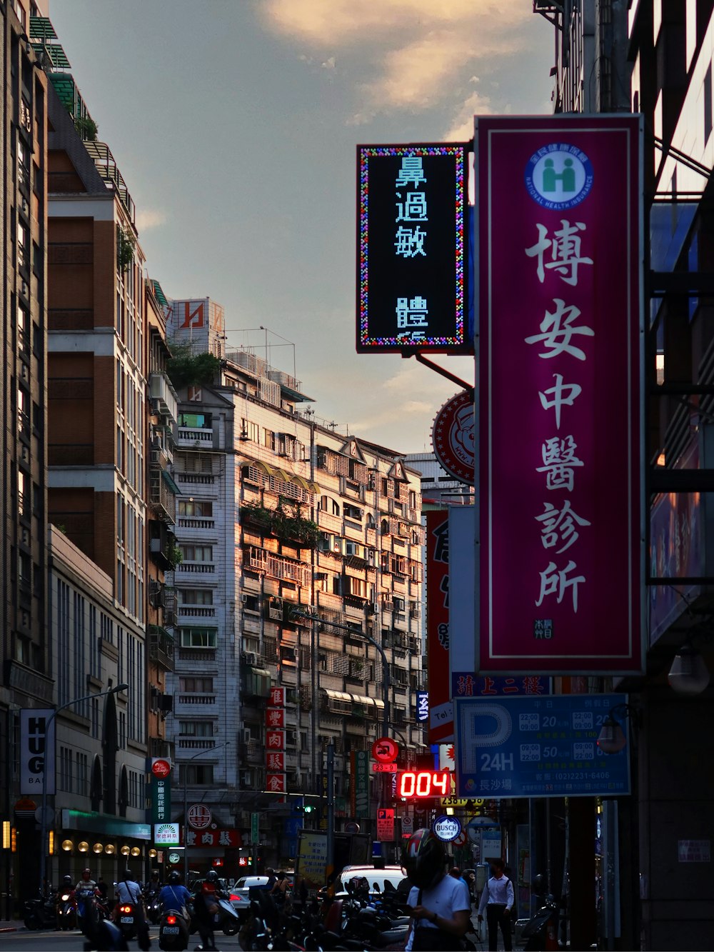 a city street filled with lots of tall buildings