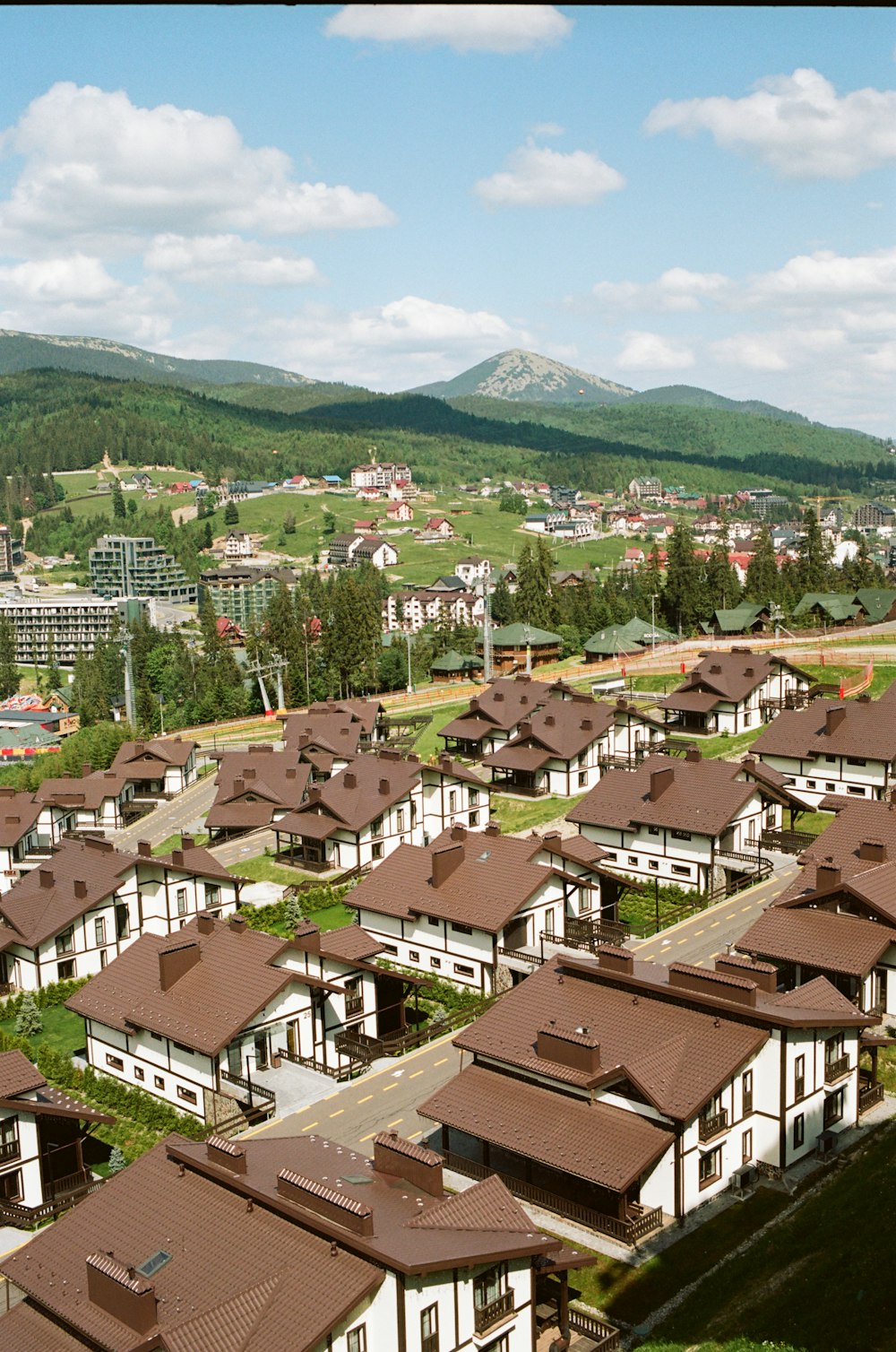 a large group of houses with brown roofs
