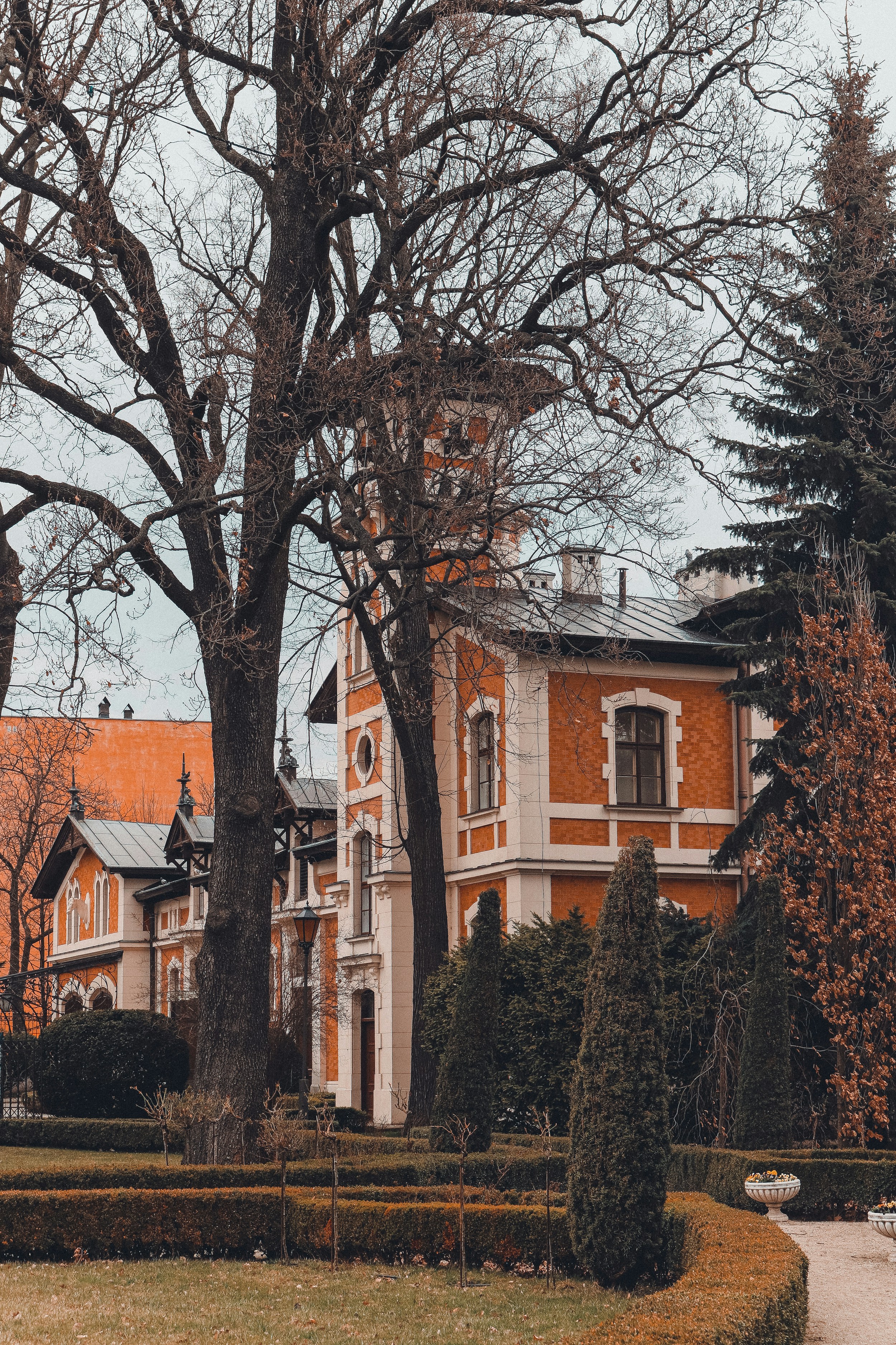 a large orange building with a clock tower