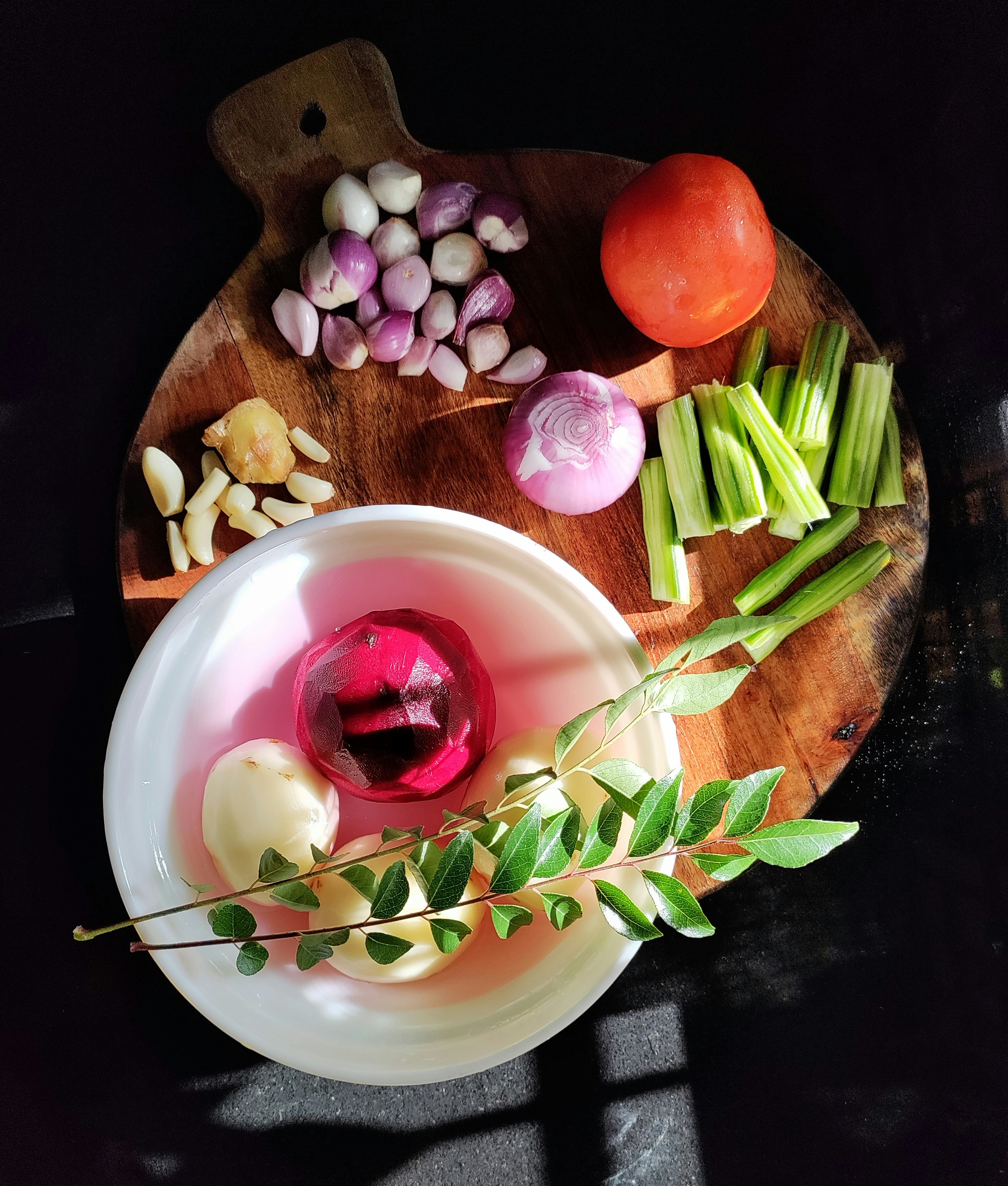 Fresh spring vegetables arranged in a refrigerator drawer, bright and organized in natural light