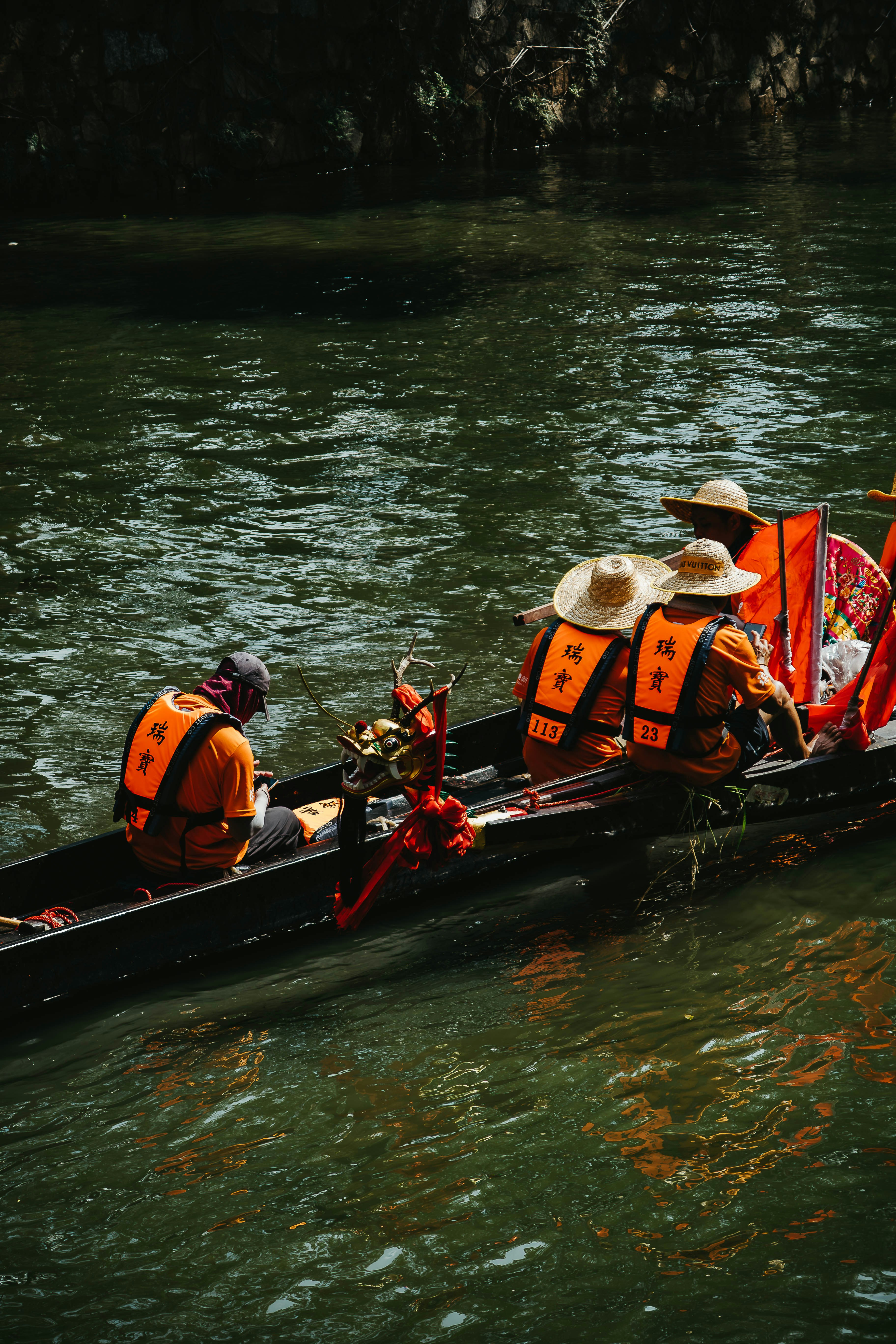 a group of people riding on the back of a boat