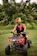 A joyful traveler riding an ATV along a green forest path near Samana.