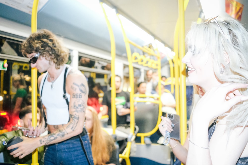 a man and a woman on a subway train