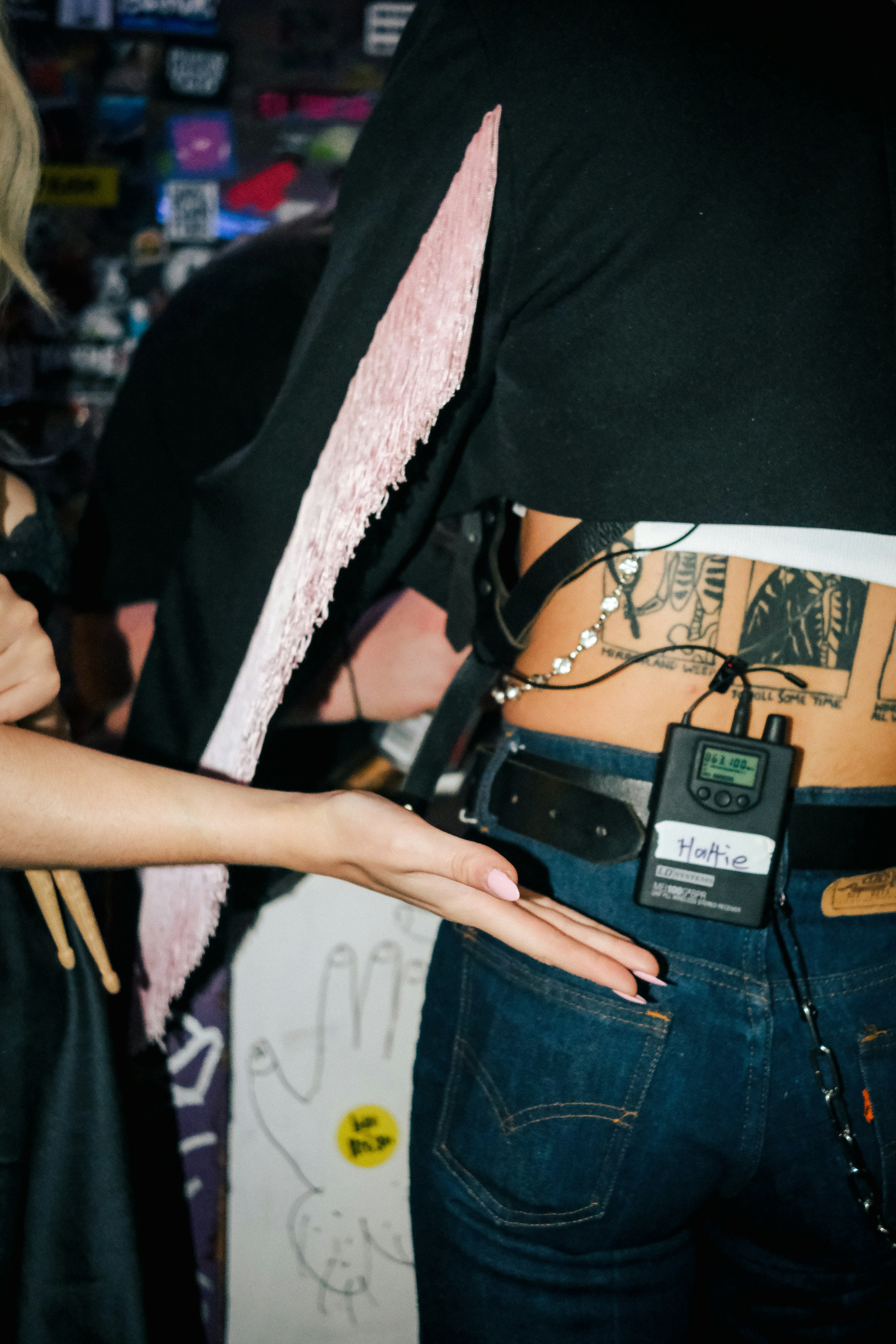 Image of a person examining clothing tags for authenticity