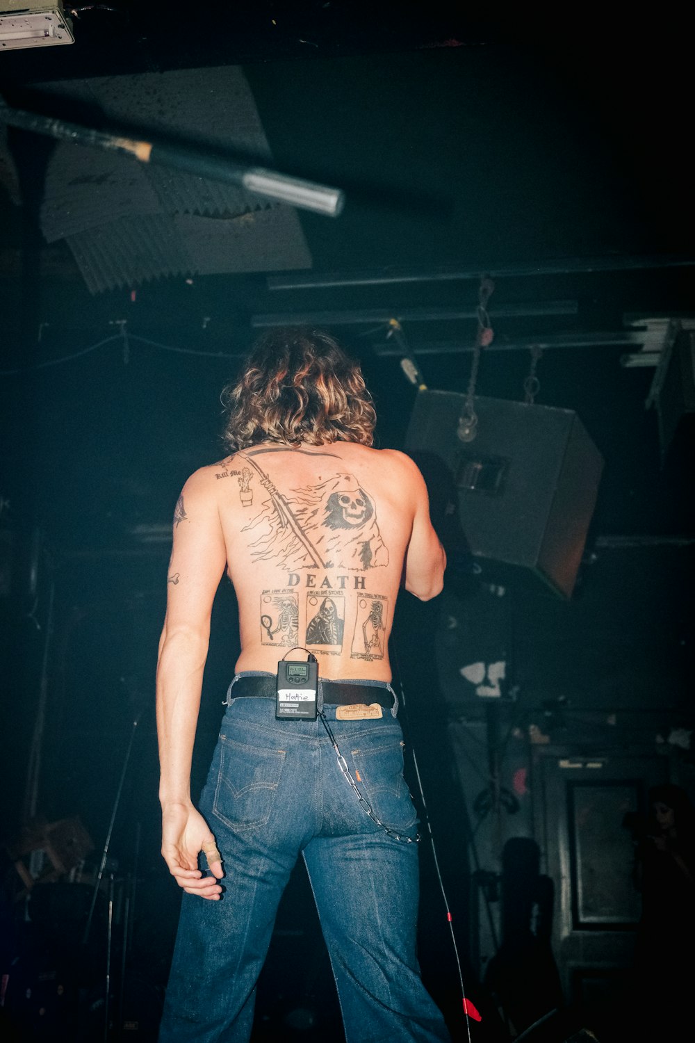 a man with a tattoo on his back