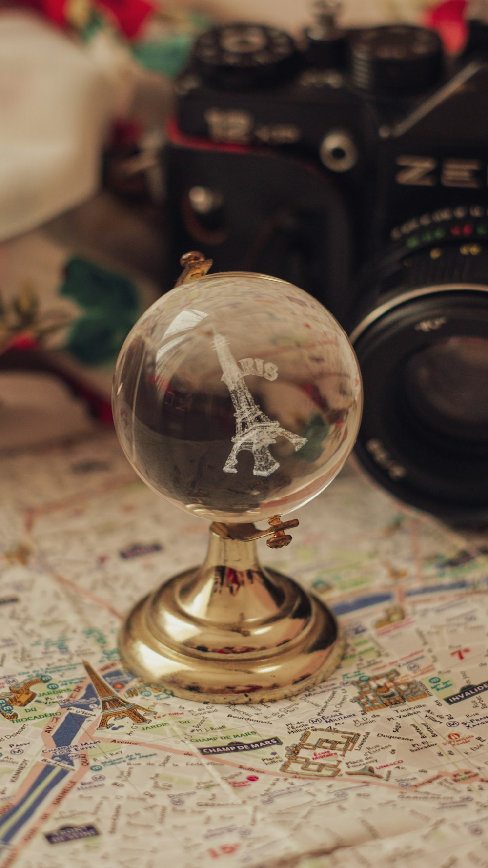 a glass ball with a picture of the eiffel tower on it