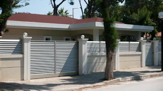 Modern metal fence around a home by Young Bros