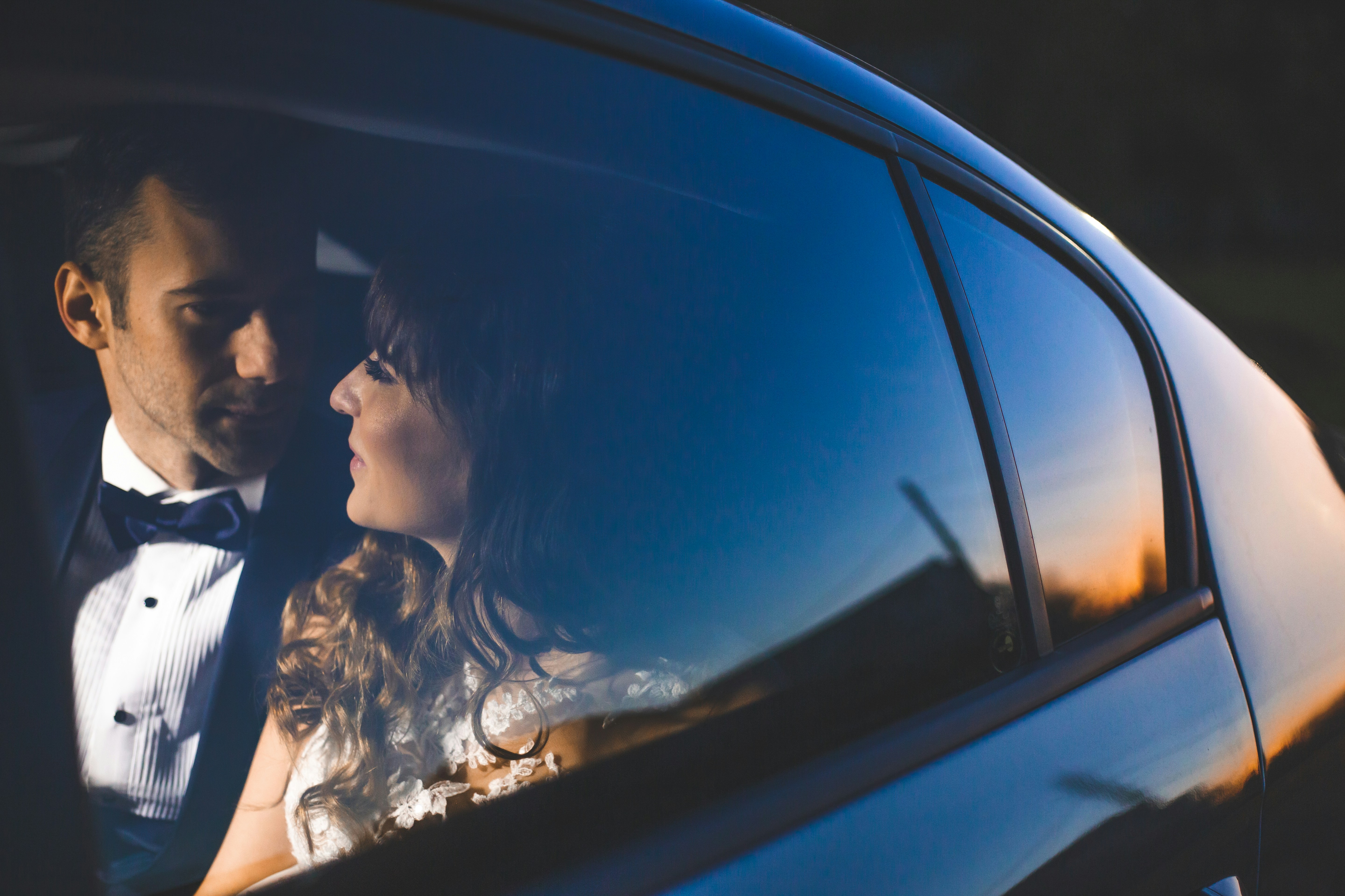 Bride and groom in car