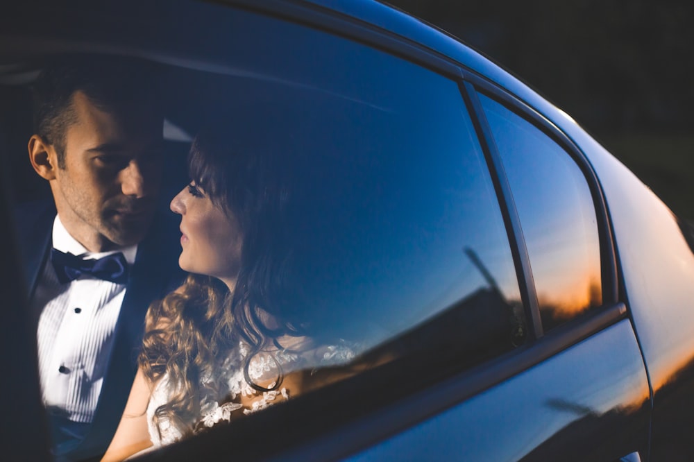 a man and a woman in a car