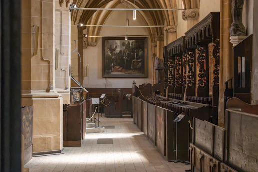 A vintage choir singing in a sunlit church, capturing the timeless spirit of 80 years of sacred music.