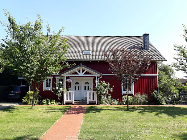 Cozy house exterior with a small garden and welcoming entrance