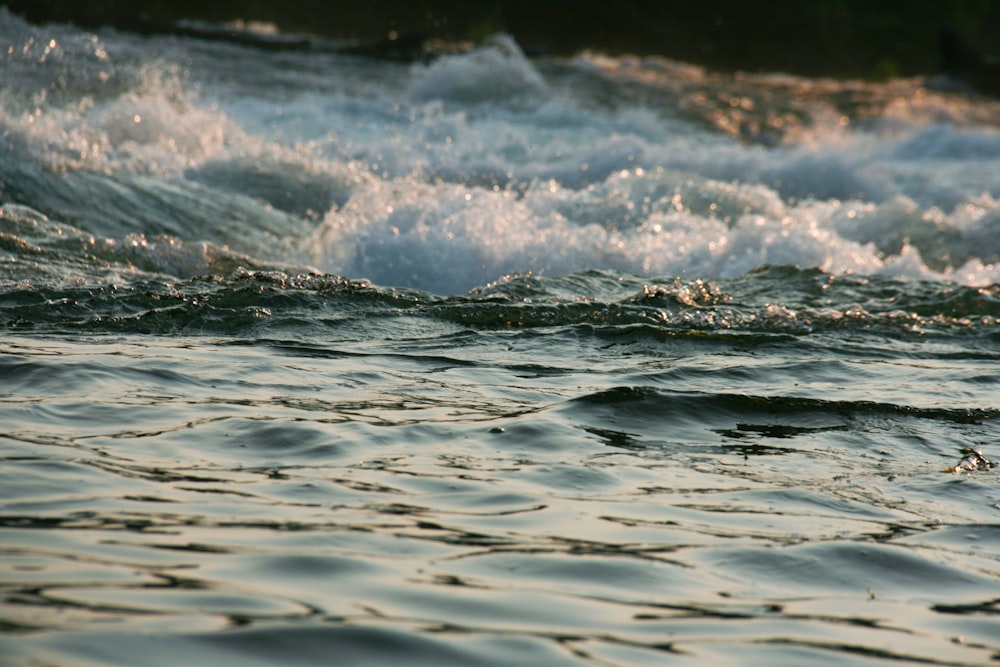 a close up of a body of water with waves