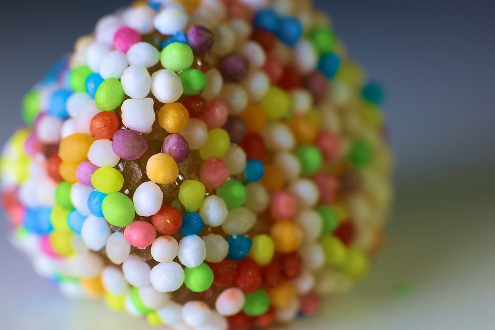 a close up of a candy ball covered in candy