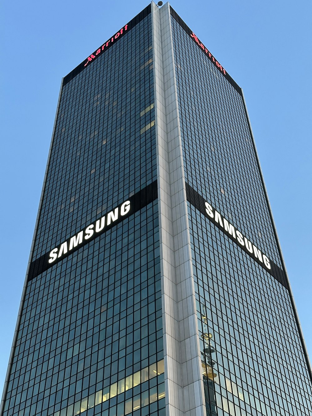 a very tall building with a sign on the side of it