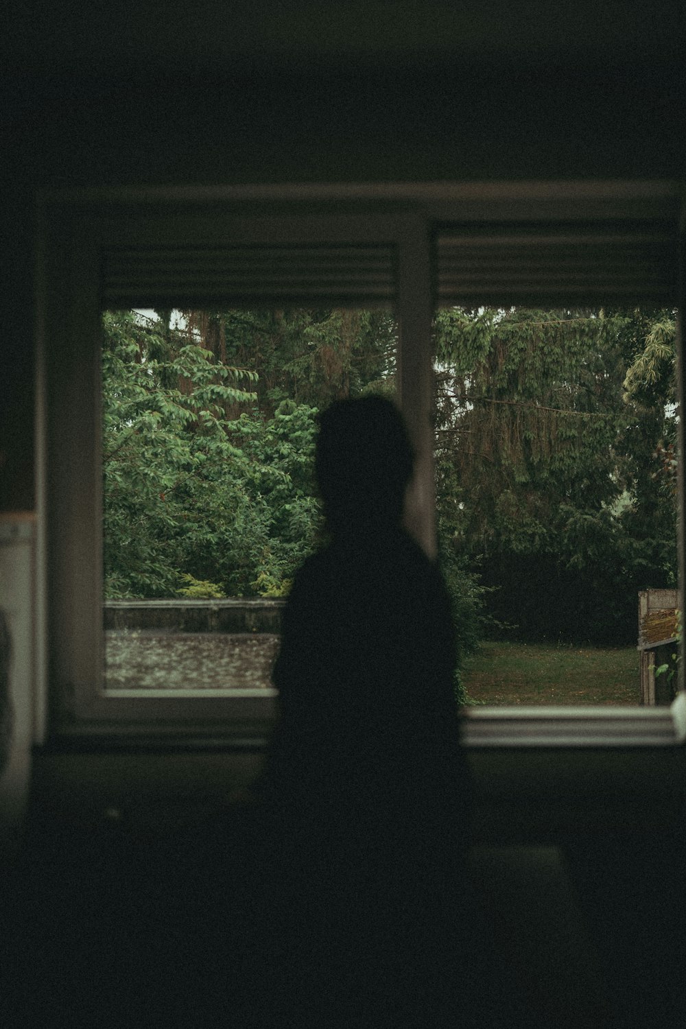 a person standing in front of a window