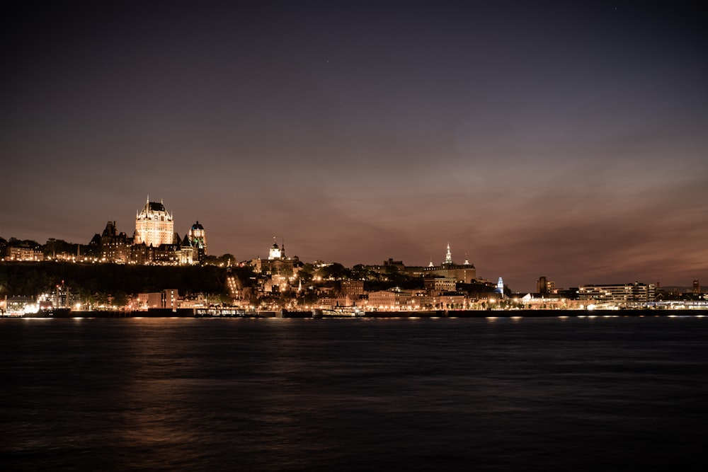 a night view of a city and a body of water