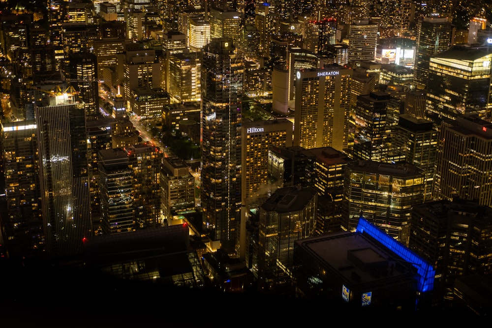 a view of a city at night from the top of a building