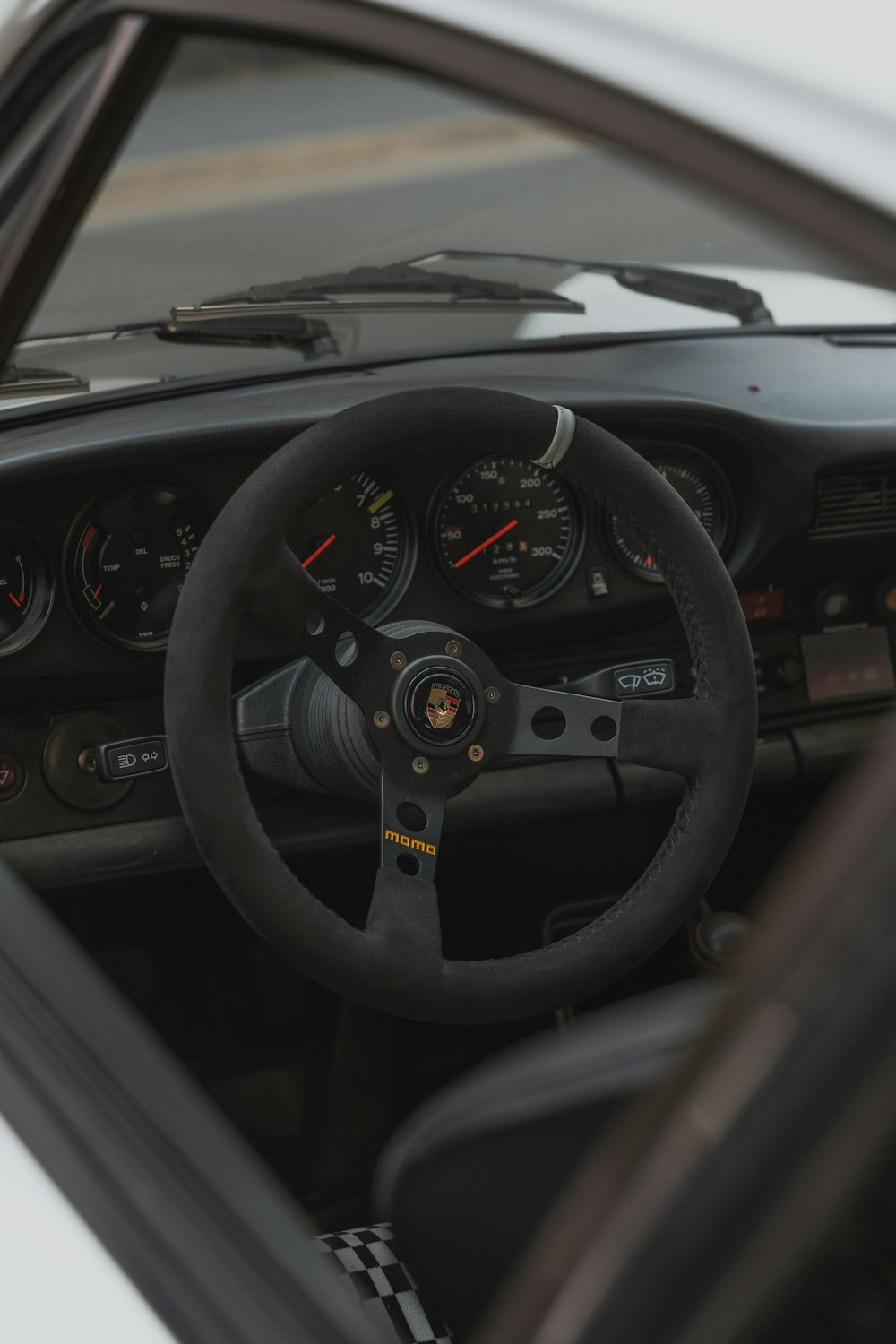 a steering wheel and dashboard of a car