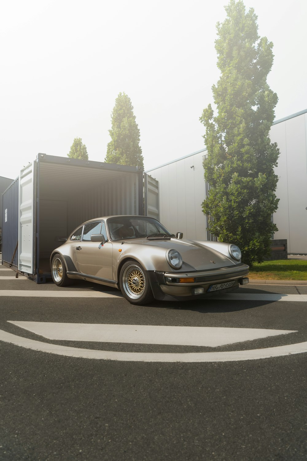 a car is parked in front of a trailer