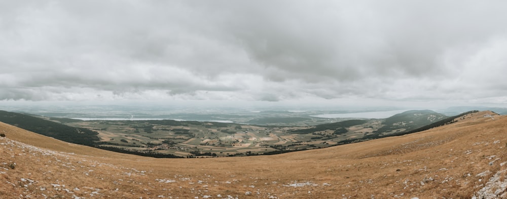 a view of a mountain range with a cloudy sky