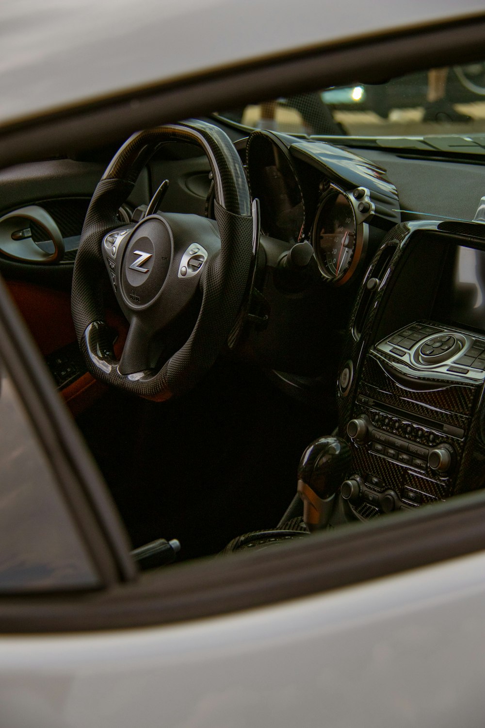the interior of a car with a steering wheel