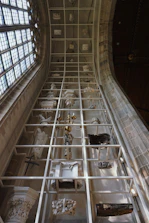 Elegant columbarium walls with gold detailing bathed in soft natural light.