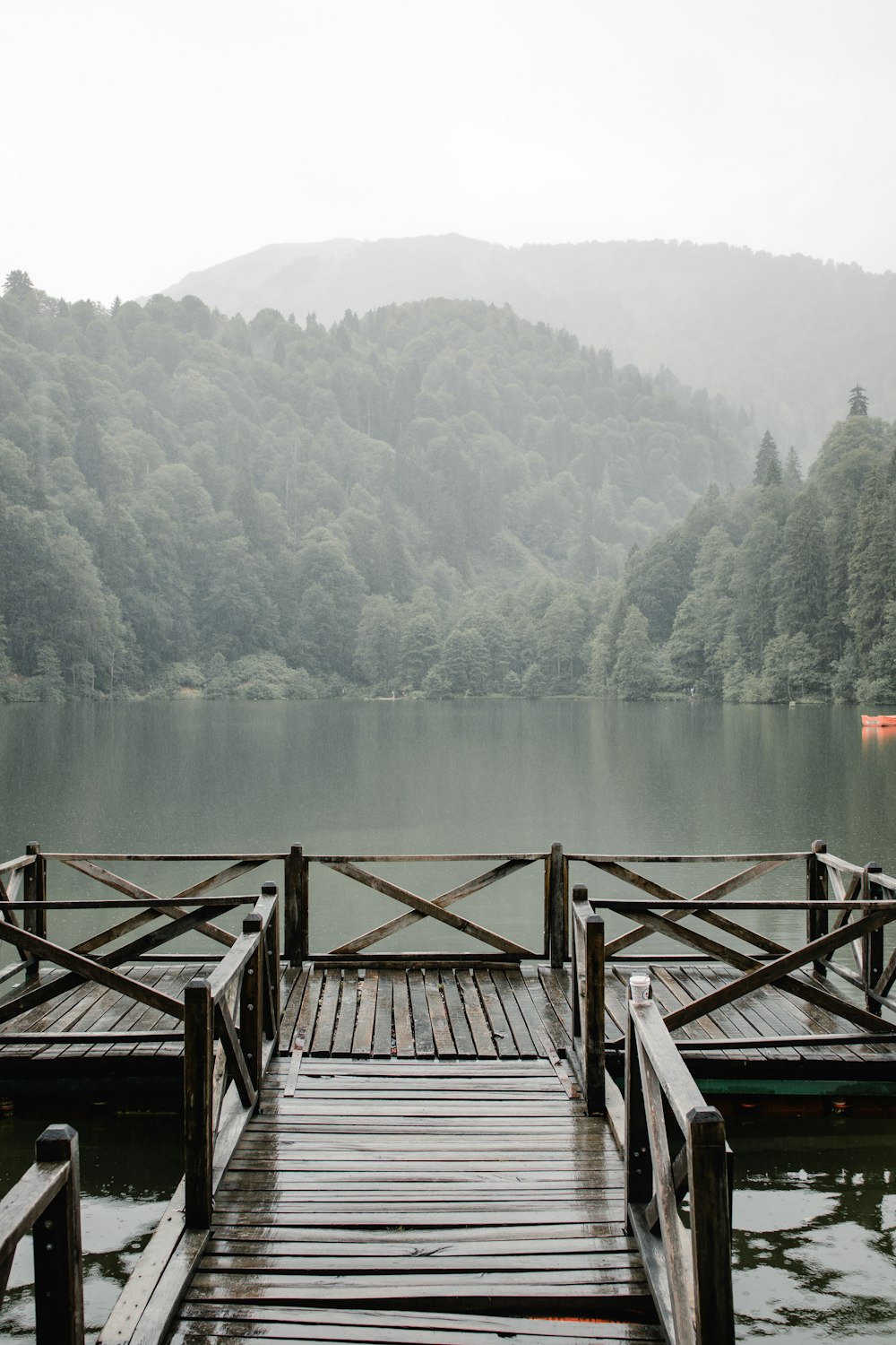 a wooden dock sitting on top of a lake