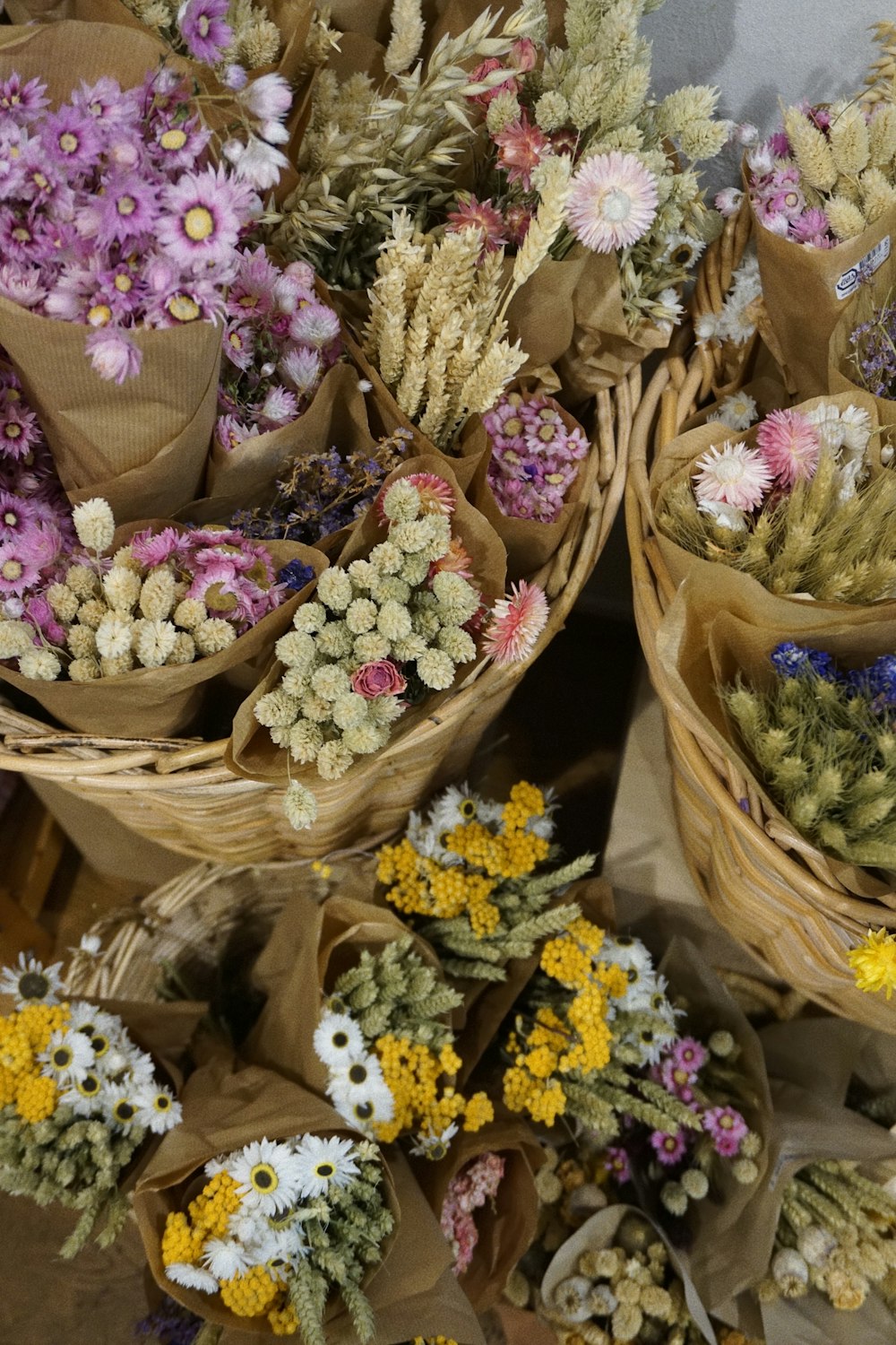 a bunch of baskets filled with lots of flowers