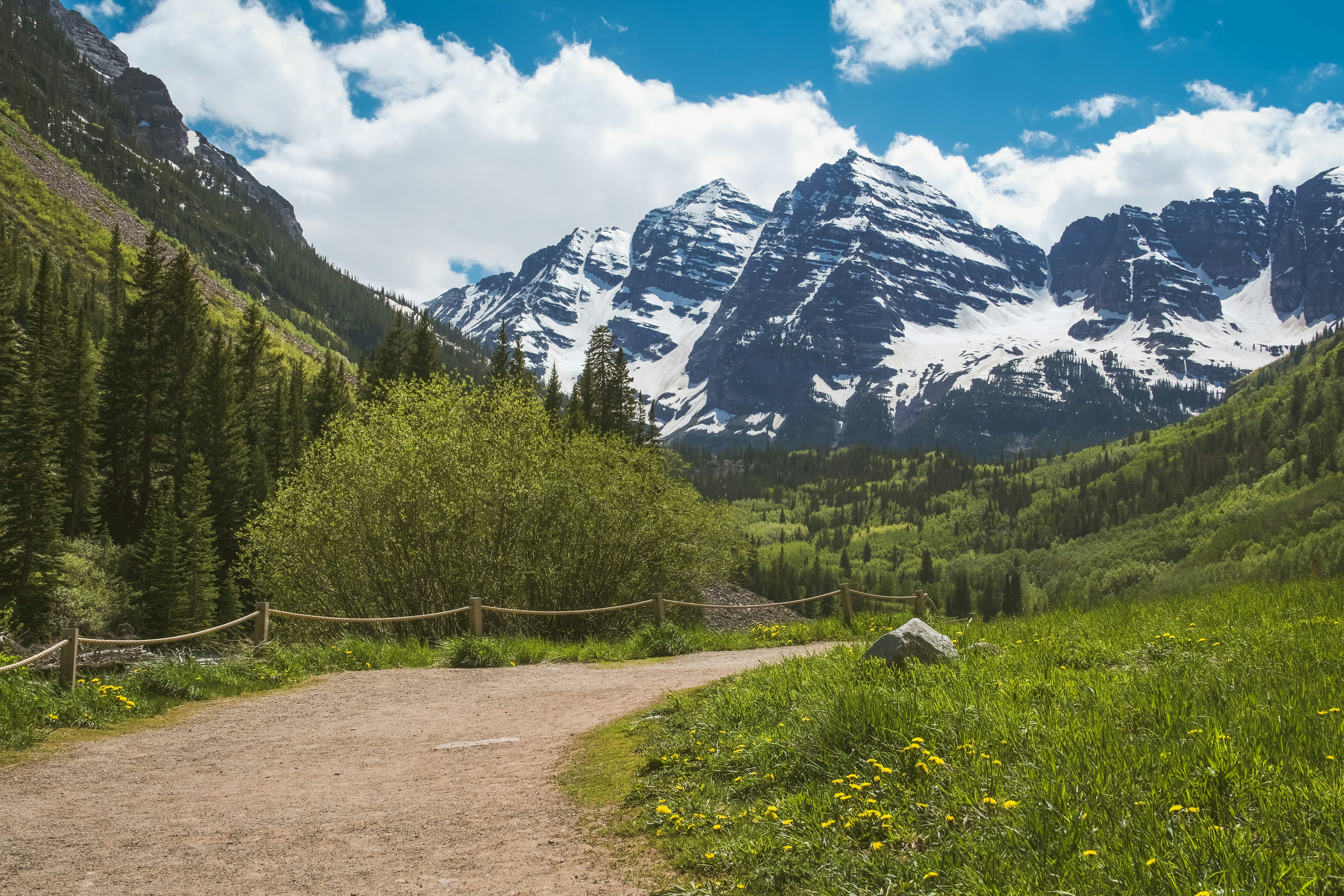 a dirt road in the middle of a mountain range