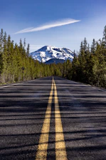 a road with a mountain in the background