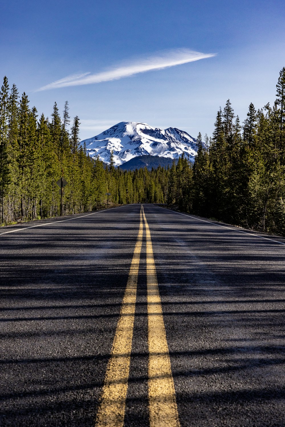 a road with a mountain in the background