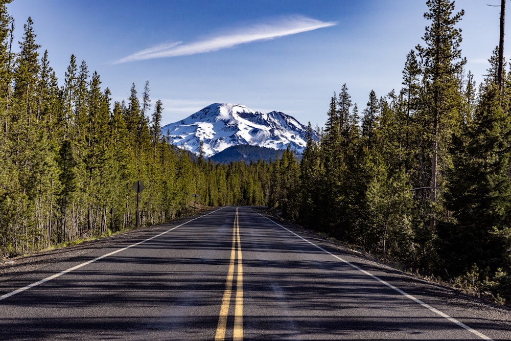 a road with a mountain in the background