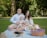 A happy family enjoying a picnic in Lakepines park.
