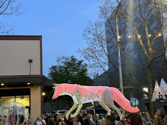 Evening community gathering with fox-themed lanterns glowing warmly.