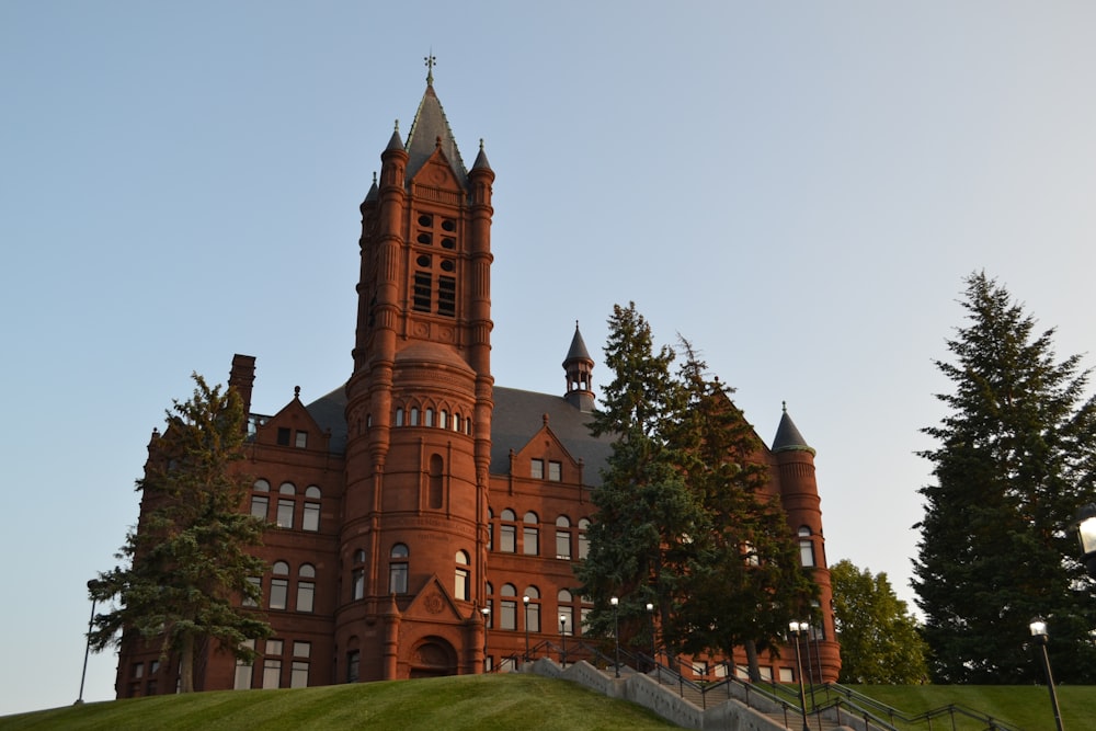 a large red building with a steeple on top of it