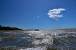 A scenic view of a boat on the water in Pontal do Paraná.
