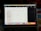A MacBook Pro screen displaying a calendar application showing the month of July 2023. Visible tabs in the browser include website links and various project files, with some text editors or development environments open. The desktop background is partially visible, colored in dark tones.