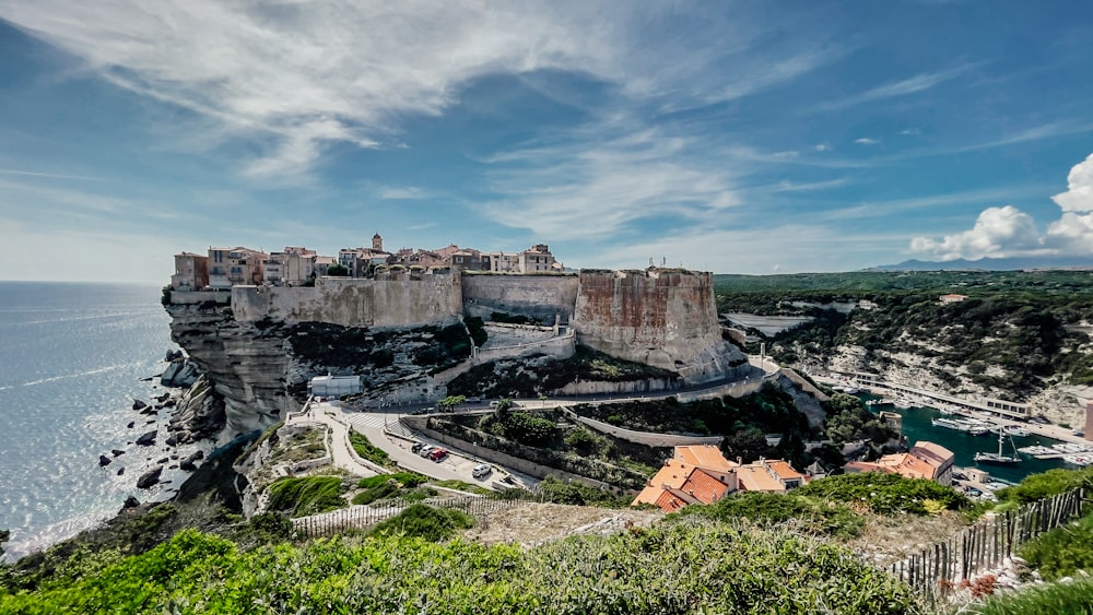 a scenic view of a city on the edge of a cliff