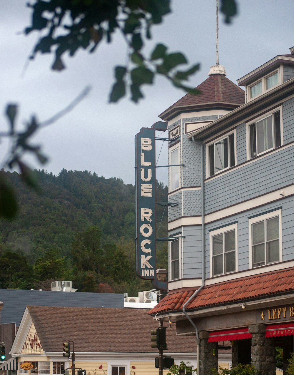 a blue building with a sign on the front of it