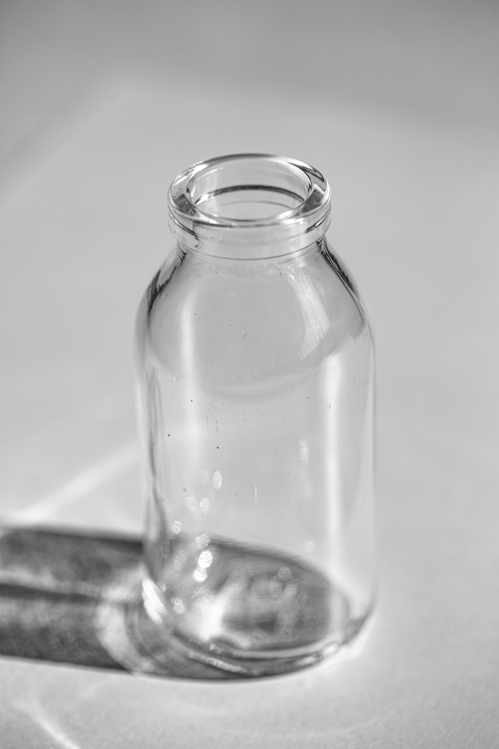 a glass jar sitting on a table next to a knife