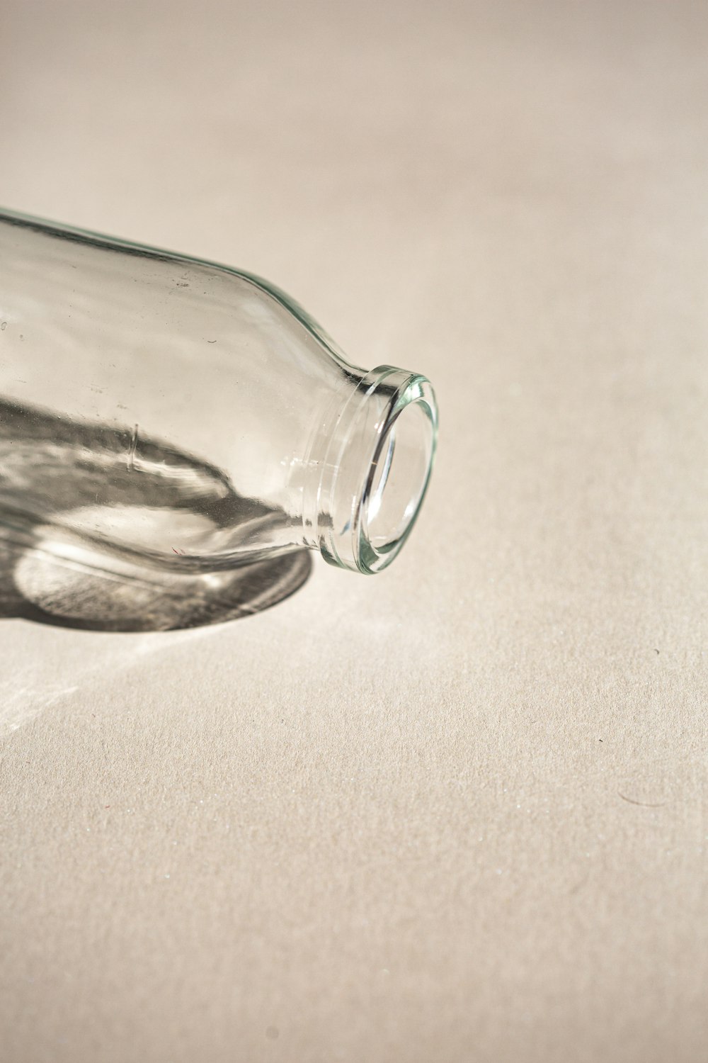 a glass bottle sitting on top of a table