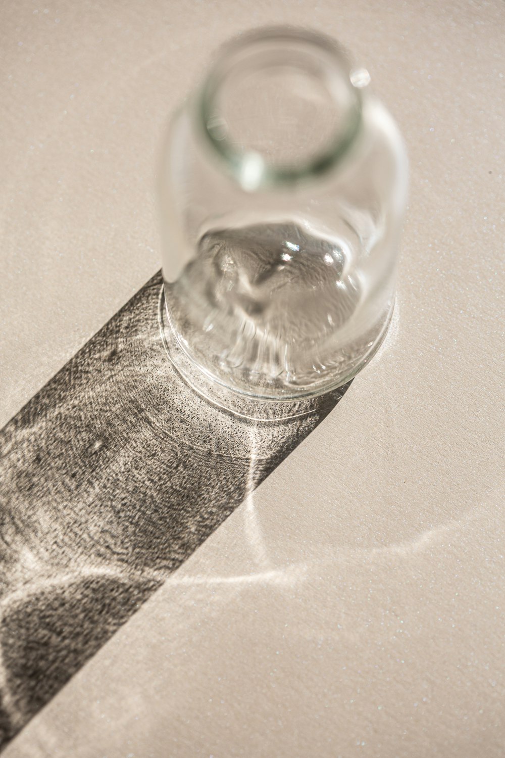 a glass bottle sitting on top of a table