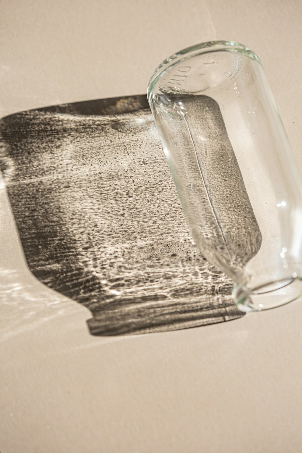 a glass bottle sitting on top of a table